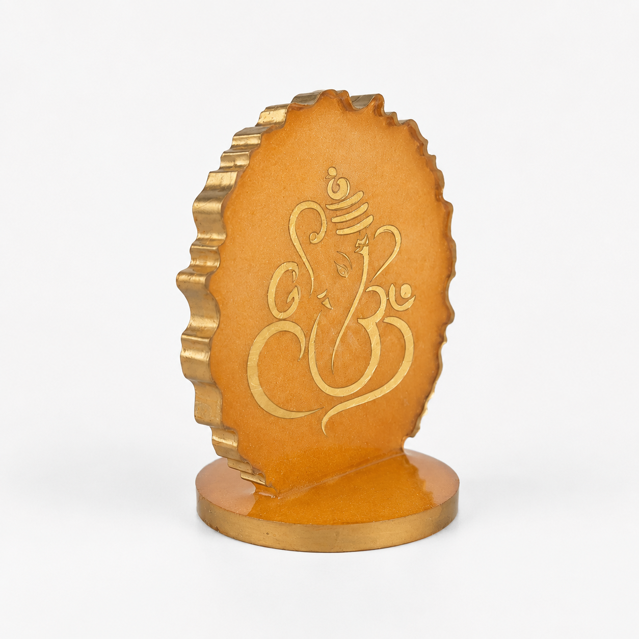 Ganesha car dashboard idol - amber gold resin - 45 degree left angle view