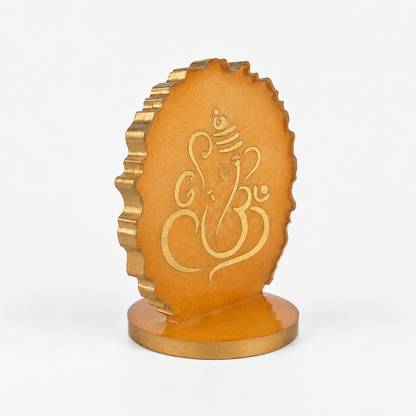 Ganesha car dashboard idol - amber gold resin - 45 degree left angle view