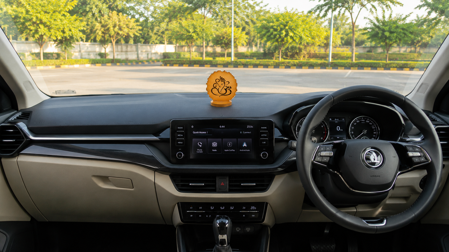 Ganesha car dashboard idol - amber gold resin - placed on car dashboard