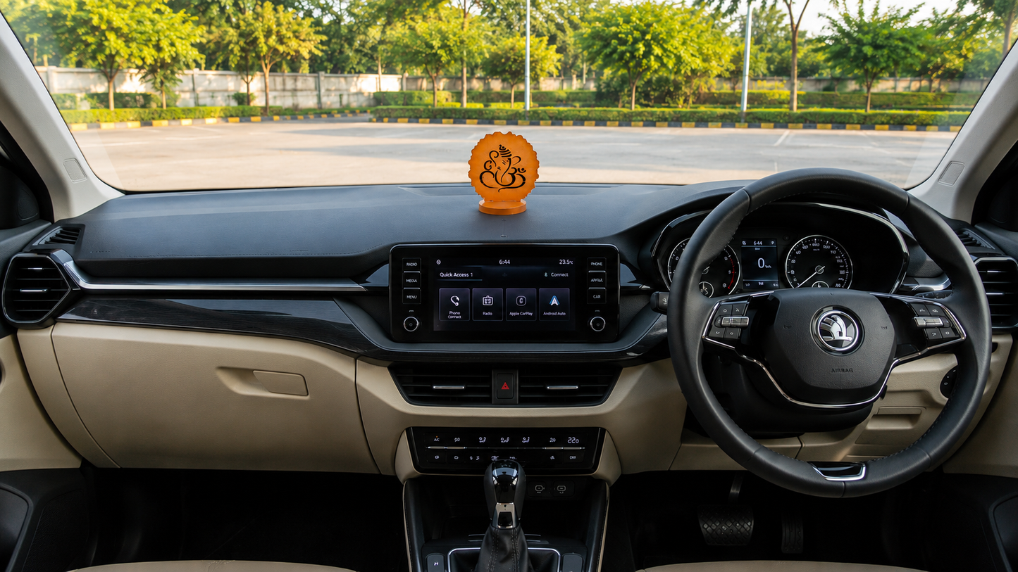 Ganesha car dashboard idol - sunset orange resin - placed on car dashboard